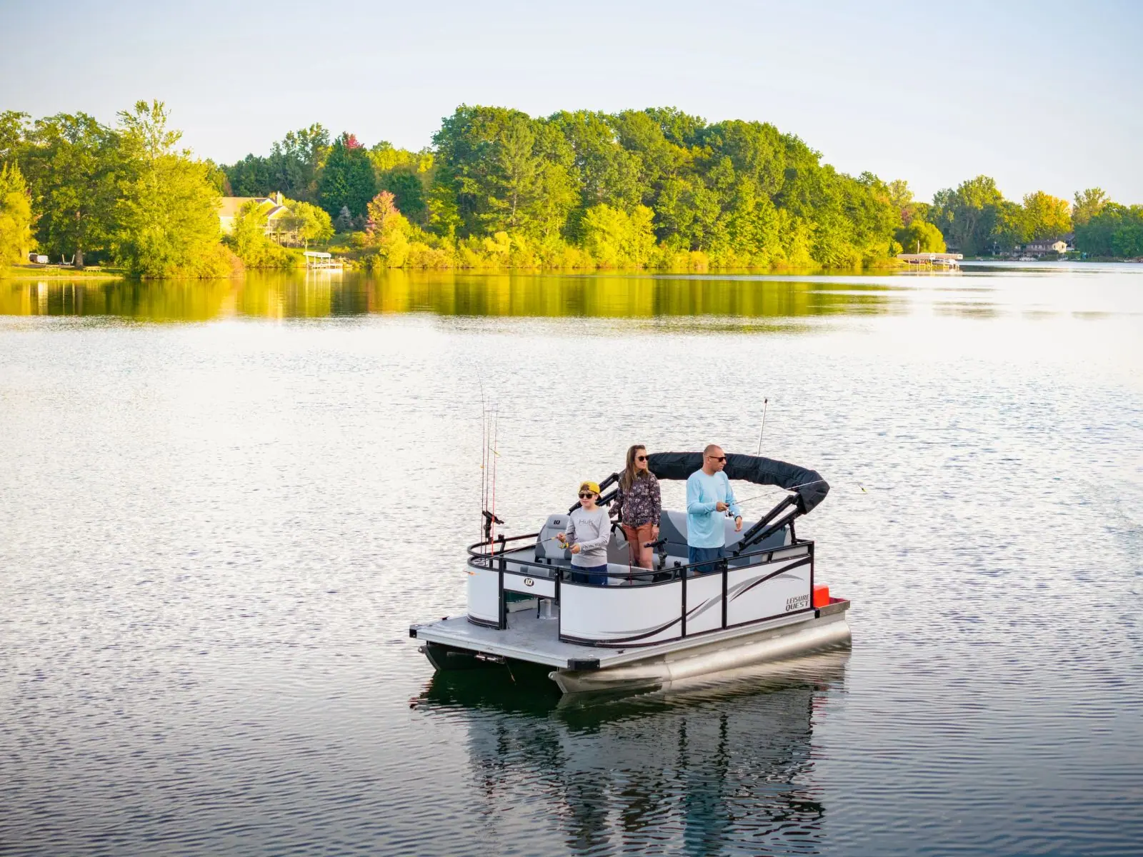 A Leisure Quest on glassy water at sunset
