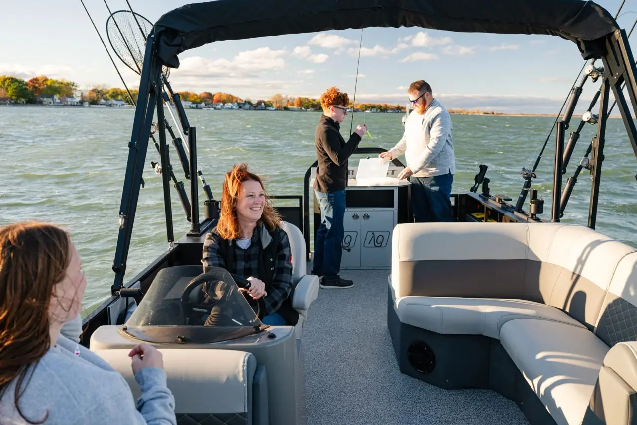 Family seated on the lounge benches of the Pro Family Fish