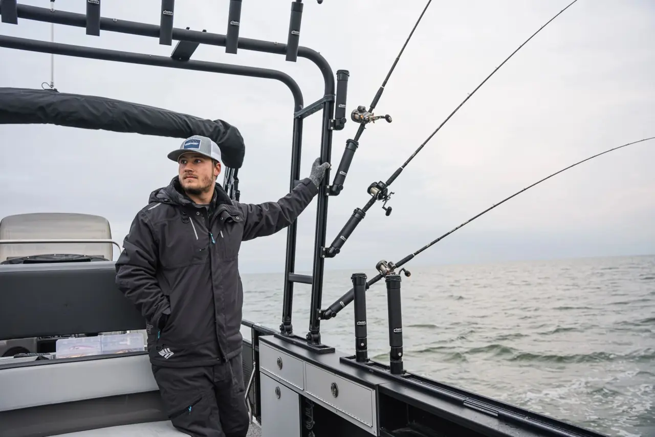 Angler reaching for a rod in the Traxstech tower