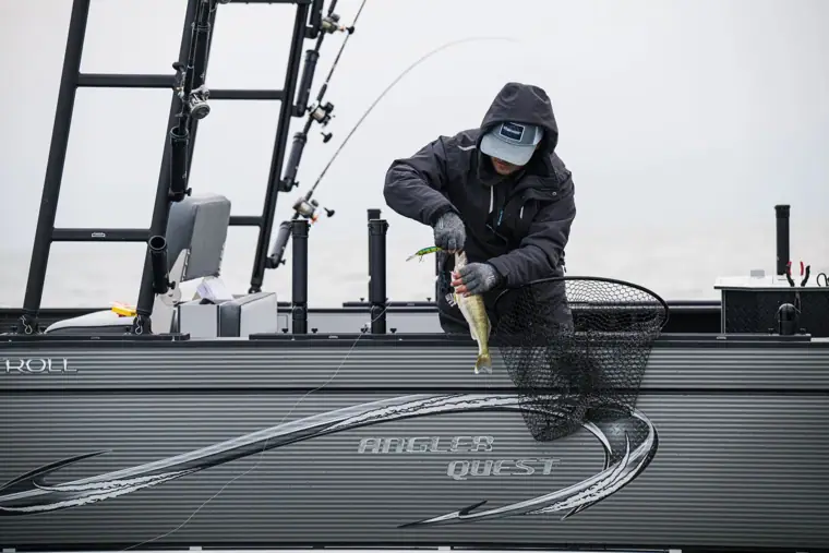Netting a fish over the side of the Pro Troll